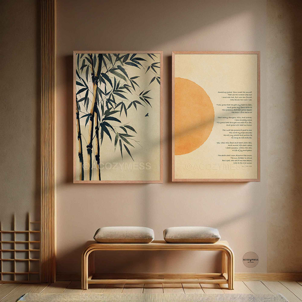 Two framed wall art prints hang above a wooden bench. The left print shows dark bamboo branches on a warm beige background, and the right print features a large orange sun and amazing grace on a cream background.