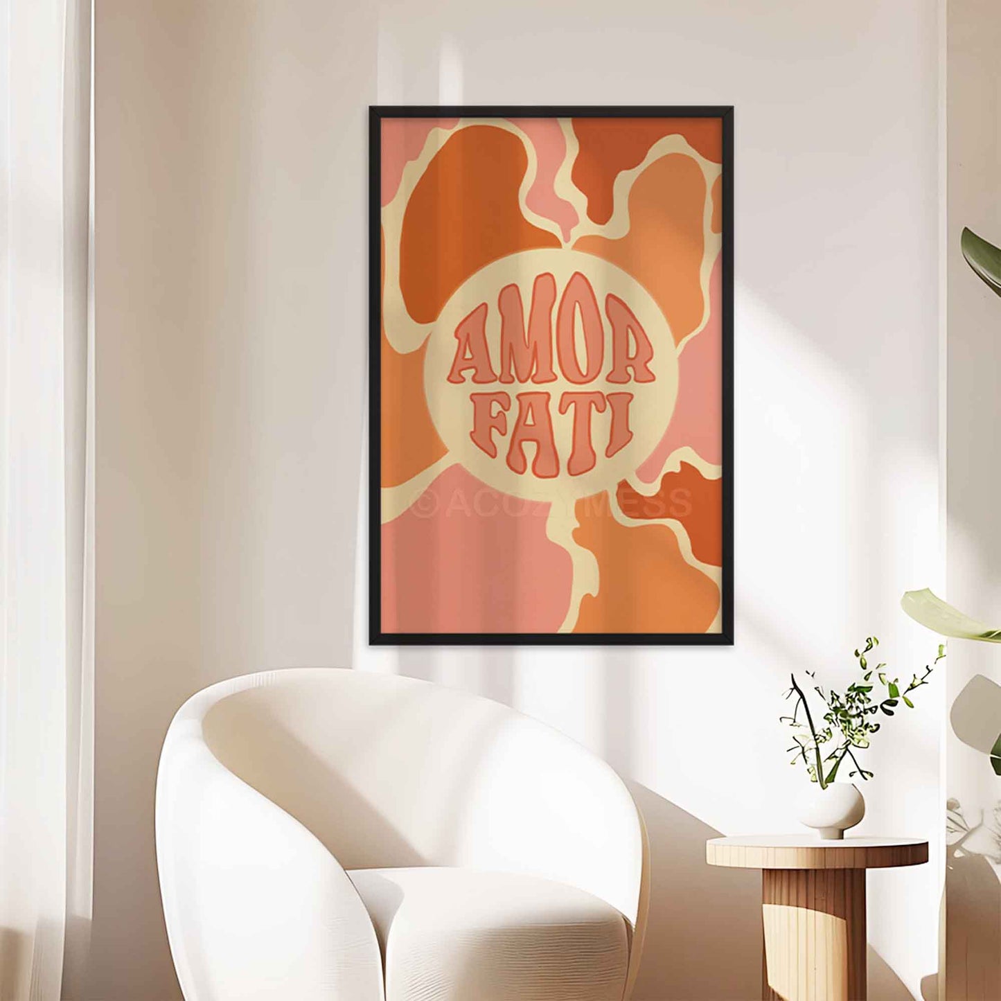 Amor Fati poster with abstract design in soft pink, orange, and beige tones, symbolizing the Stoic philosophy of loving one's fate, displayed in a black frame.