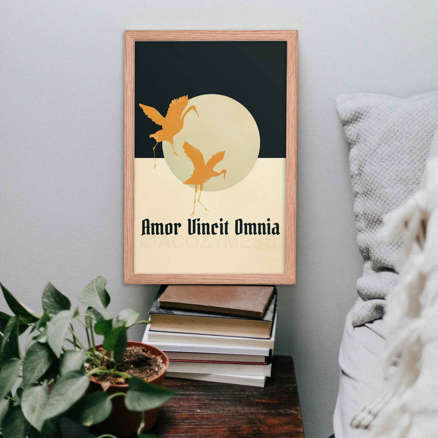 Amor Vincit Omnia Poster in beige, blue and yellow with flying birds art, framed in oakwood.