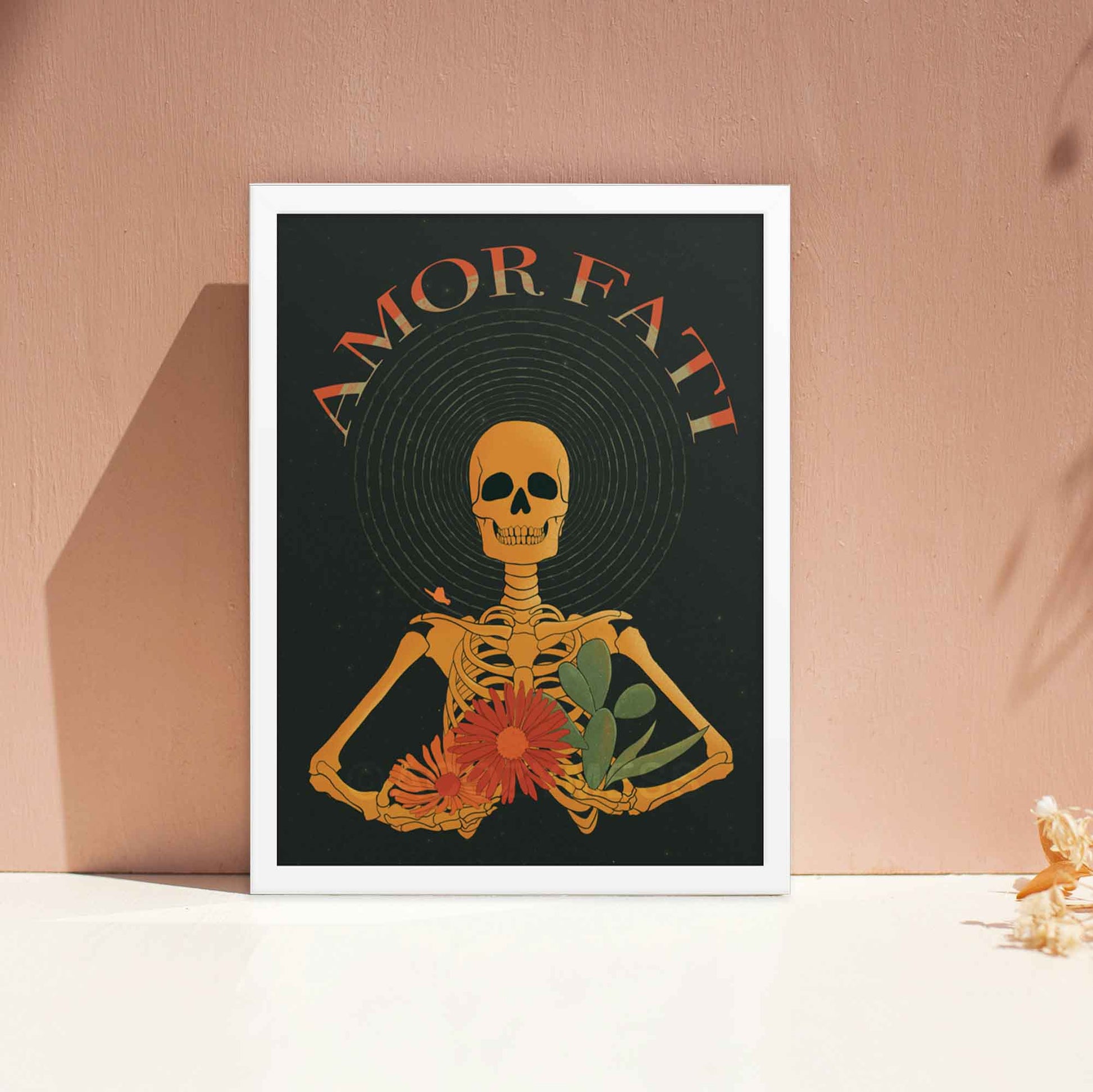 Amor Fati Print with yellow skeleton with flowers and cacu=tus design on black background Art in white  frame