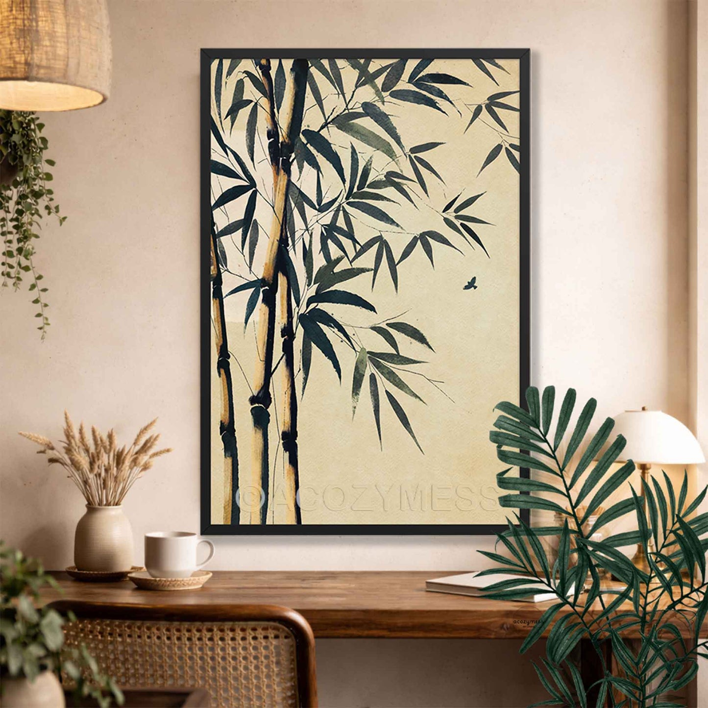 Black Framed zen artwork of bamboo and leaves on a wall above a wooden desk.