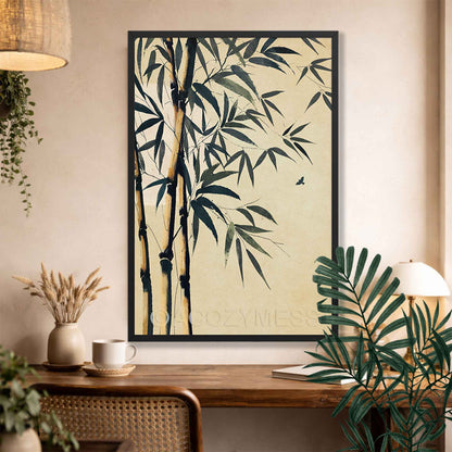 Black Framed zen artwork of bamboo and leaves on a wall above a wooden desk.