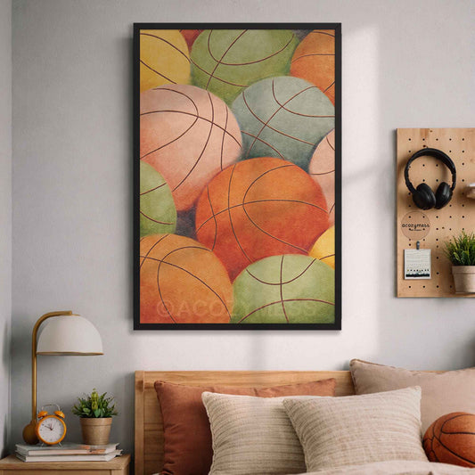 Colorful abstract art print of basketballs on a wall above a bed in a bedroom.