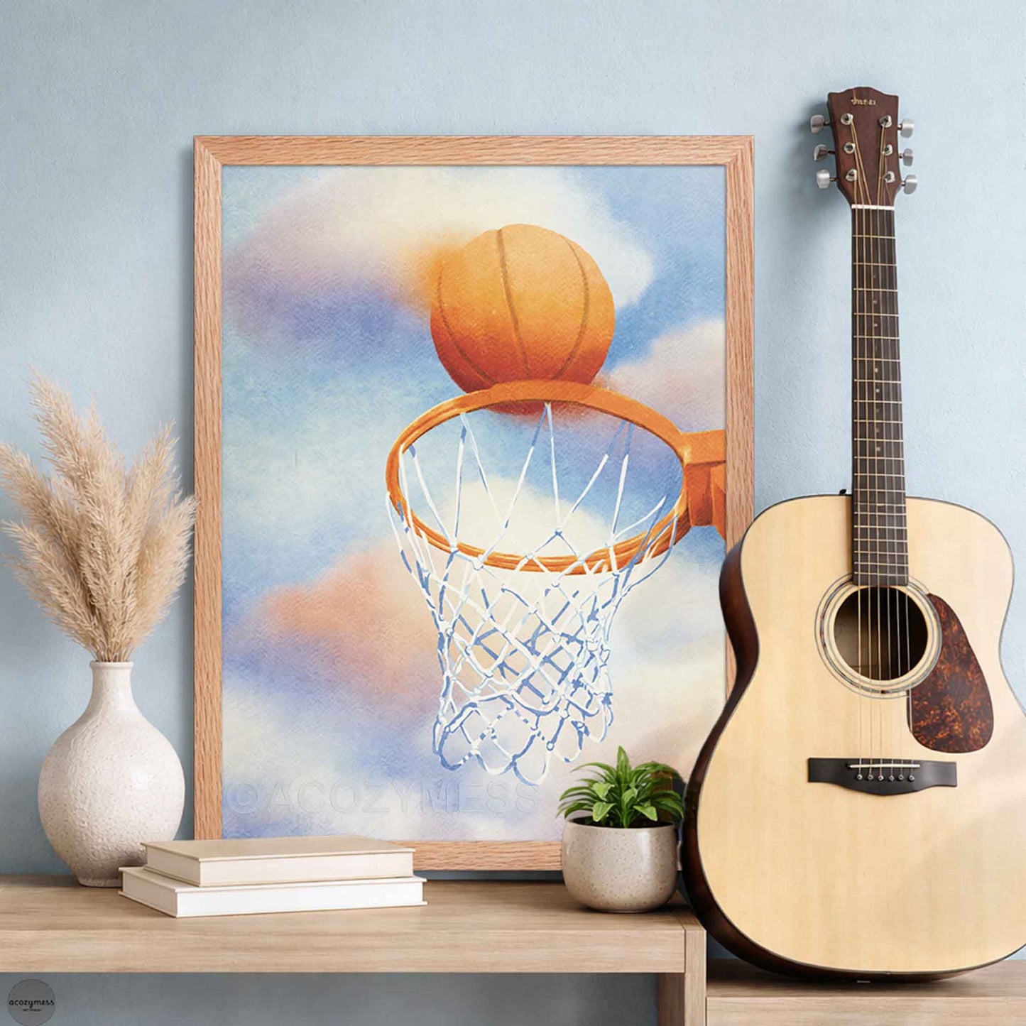 Modern sports wall art in oakwood frame—blue and orange basketball scene with hoop and colorful cloud background.