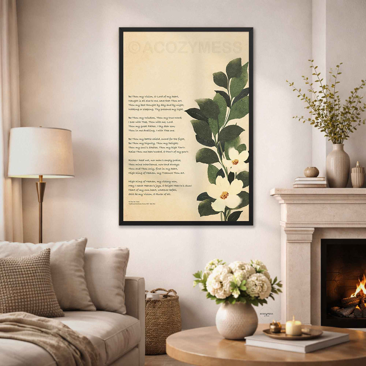 Be thou my vision art print with botanical art in black frame displayed on a living room wall.