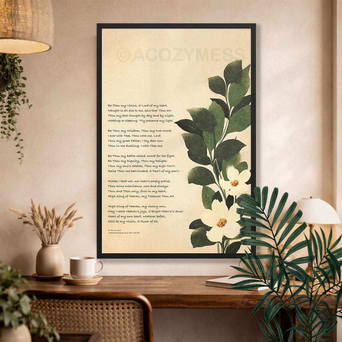 Be thou my vision art print with botanical art in black frame displayed above a study desk.