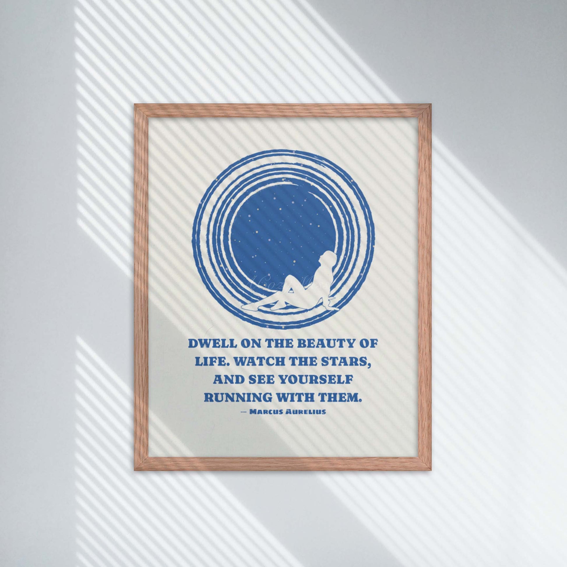 Dwell on the beauty of life. Watch the stars, and see yourself running with them.” by marcus aurelius stoic quote with an illustration of a person looking at sky blue on white in oak frame.
