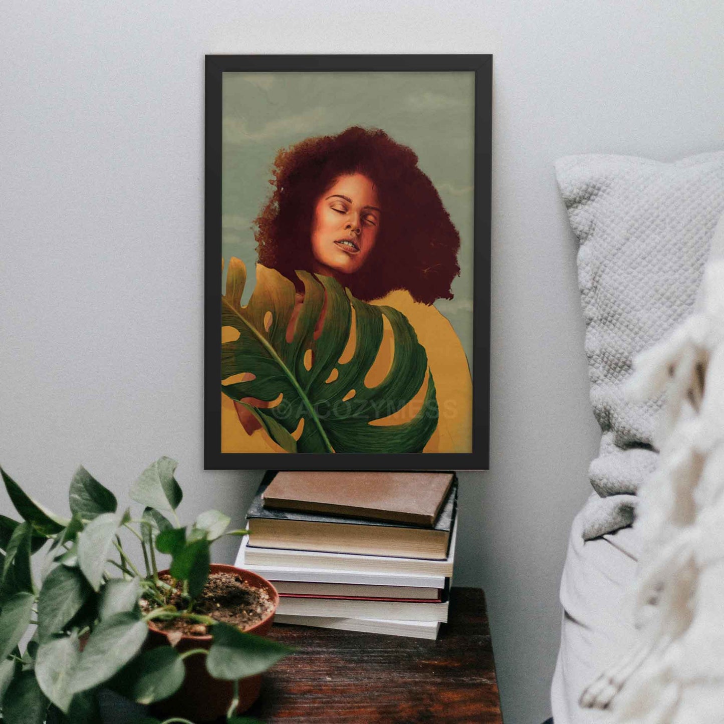 Black Woman Wall Art featuring a vibrant yellow background, confident pose, and monstera leaf in yellow, blue and green poster framed in white.