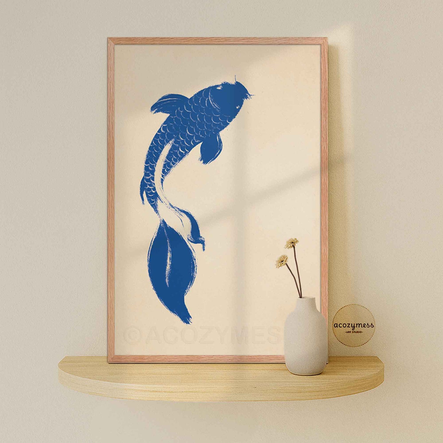 Blue koi fish print with beige background displayed in an oakwood frame, warm natural finish.