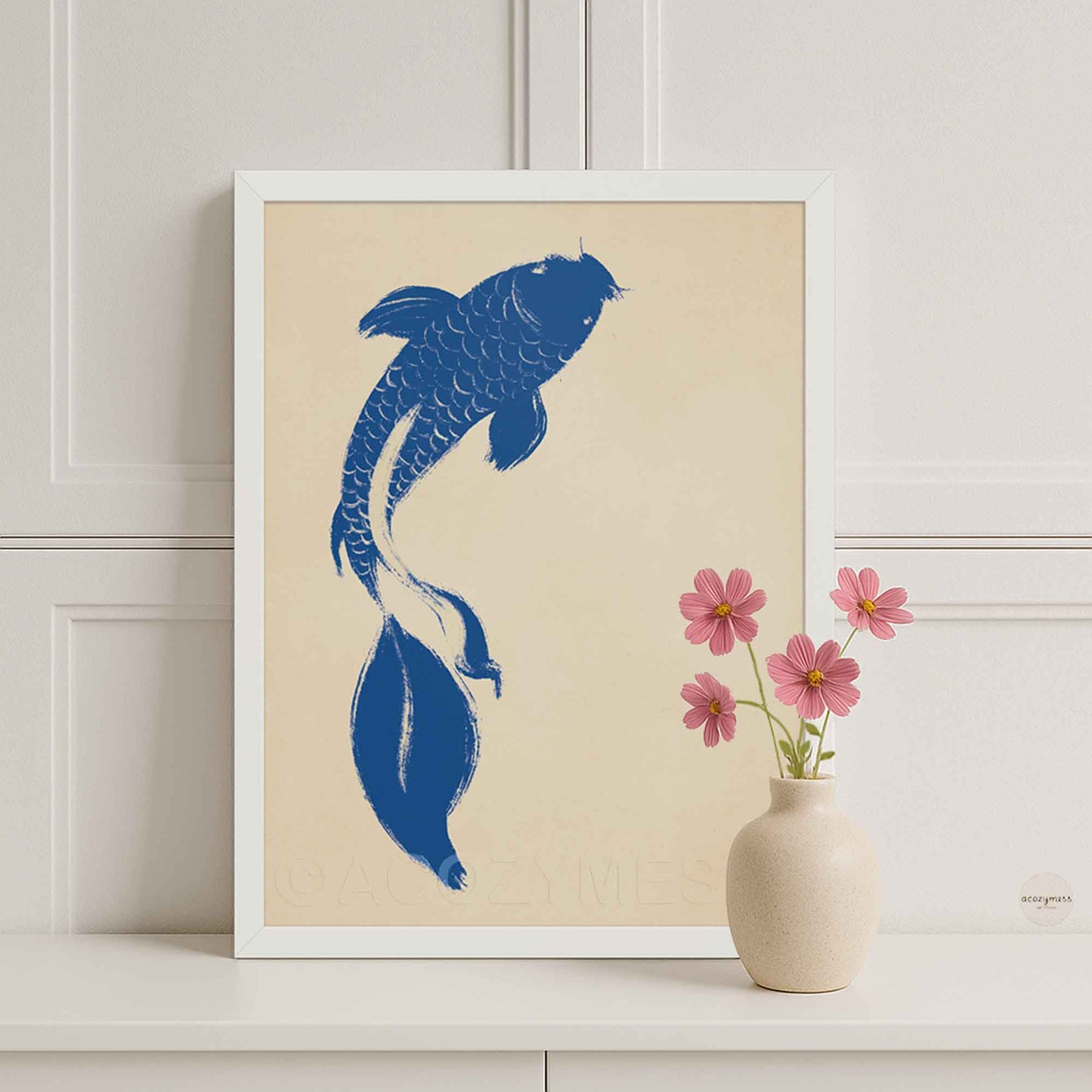 Minimalist blue koi fish wall art with beige background displayed in a clean white frame for a light, airy aesthetic.