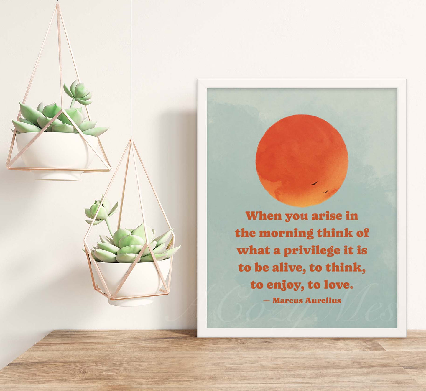 Stoic Art poster depicting a brilliant orange sun rising in a  blue sky, accompanied by a quote by Marcus Aurelius that reads: 'When you arise in the morning, think of what a precious privilege it is to be alive - to breathe, to think, to enjoy, to love. Available in white frame.