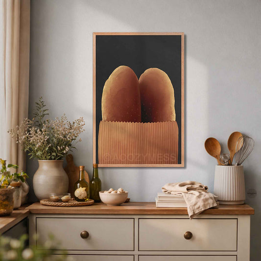 Oakwood-framed baguette wall art with two baguettes in a brown paper bag on a dark gray background in a cozy modern kitchen