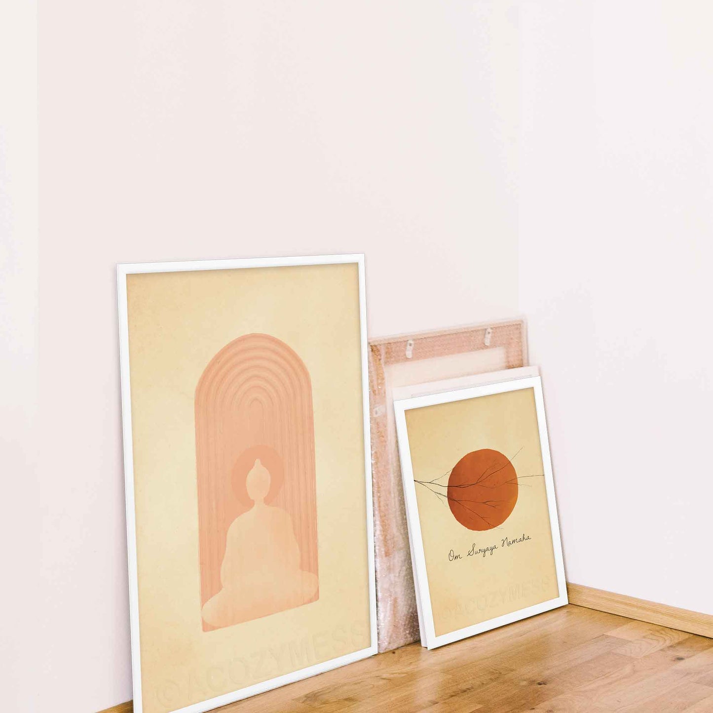 Buddha in meditation in beige and dusty pink color, calming wall art print in white frame and sun salutation art poster in white frames.