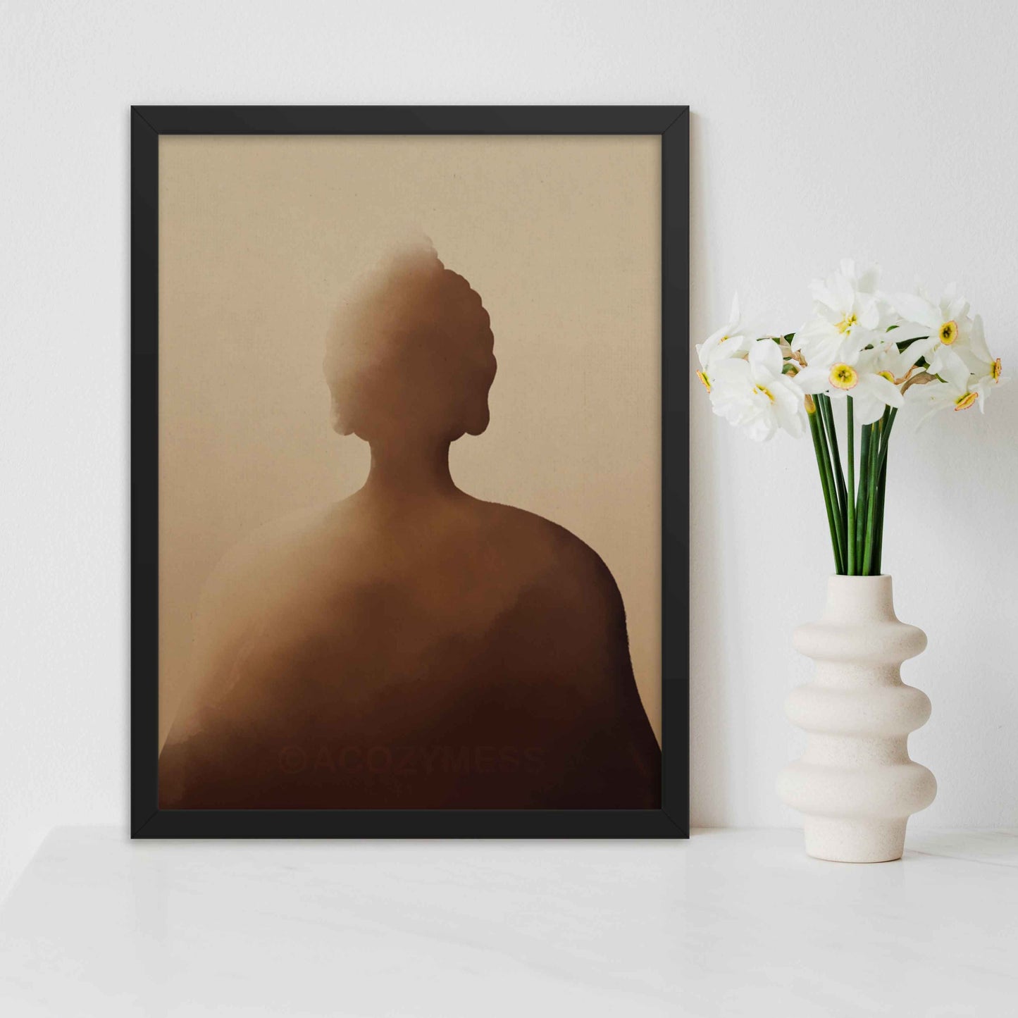 Buddha wall art in deep shades of earthy brown hues art print in black frame.