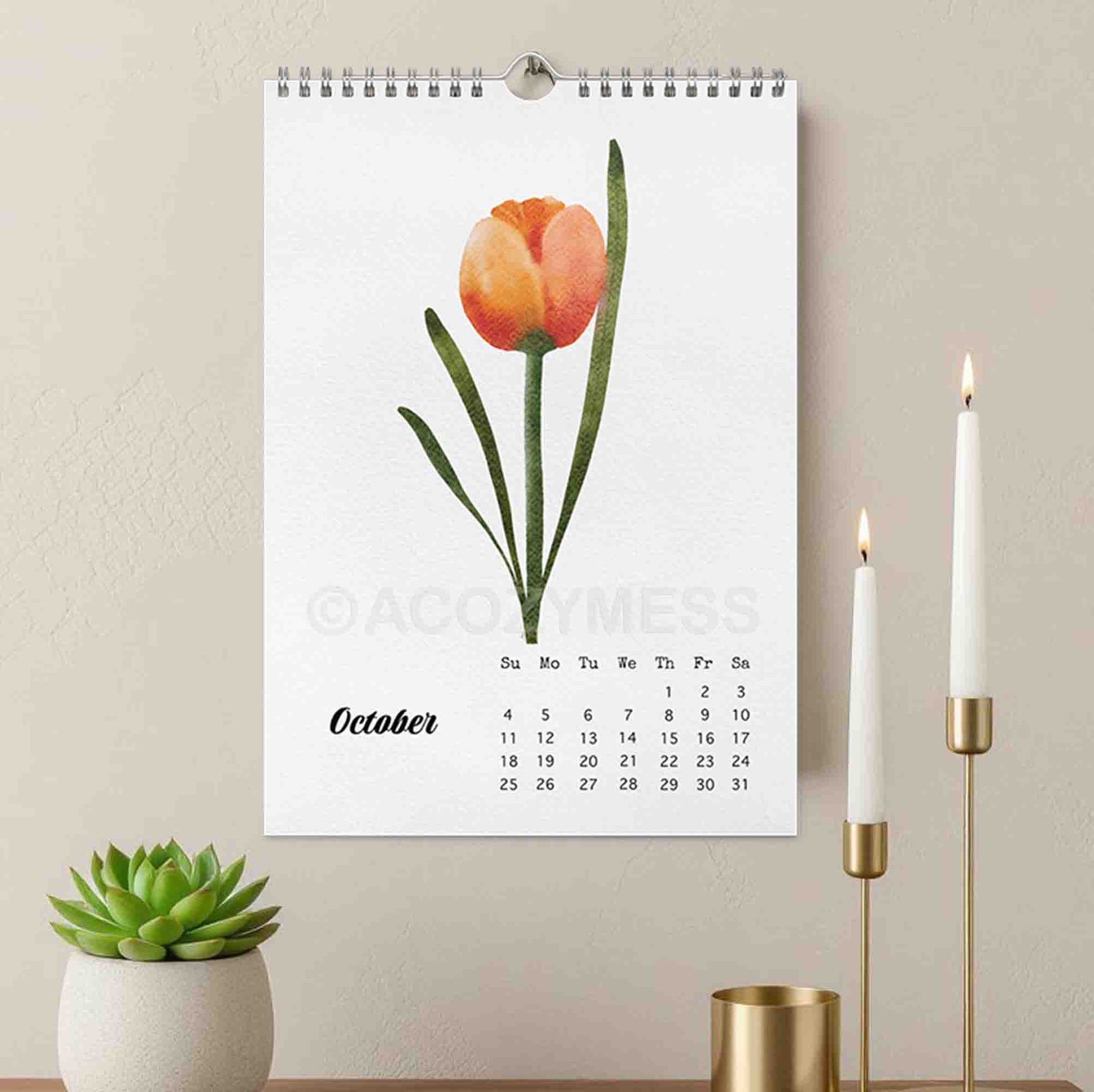 Calendar with a tulip design for October, displayed on a wall with decorative items.
