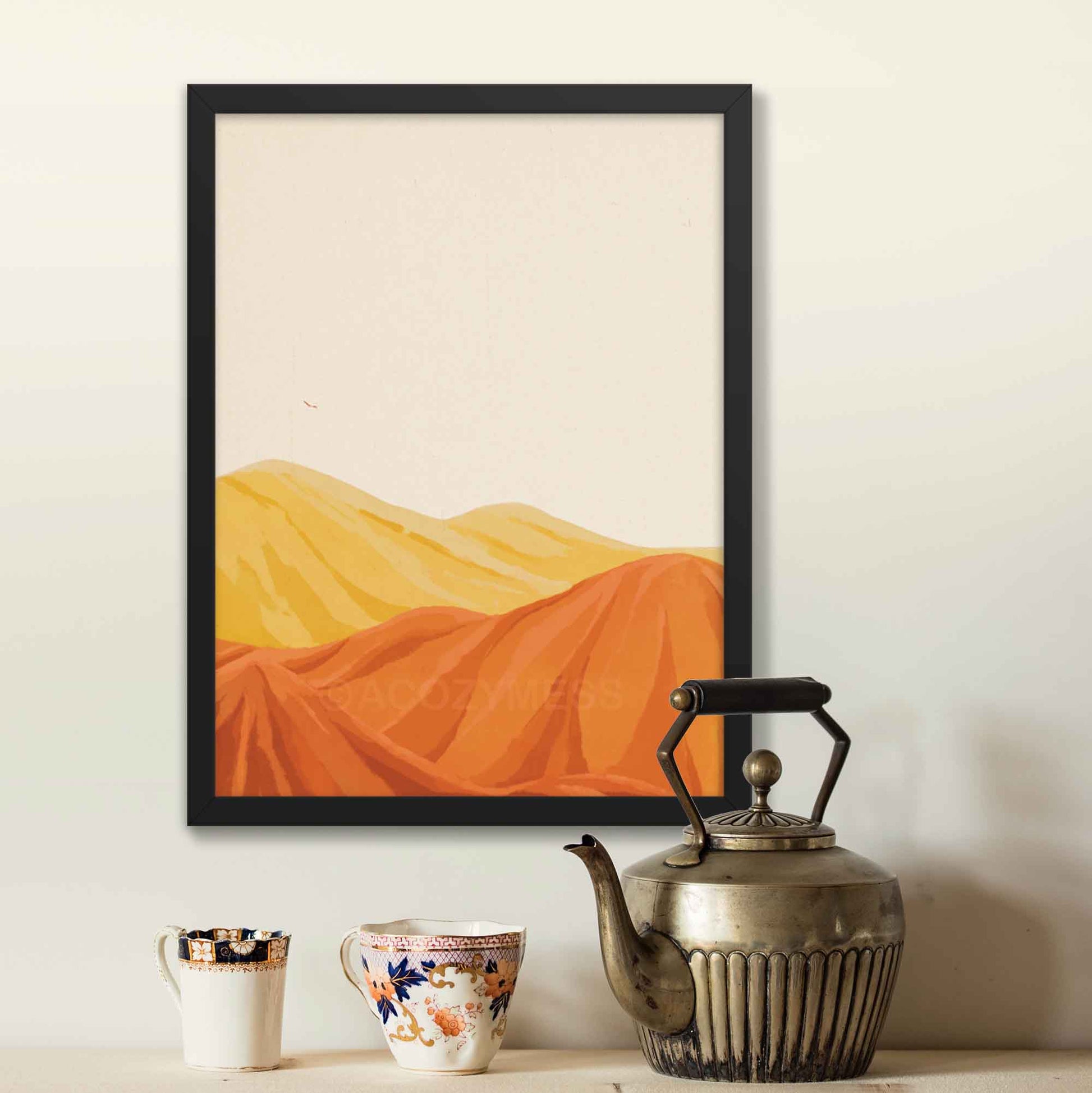 Desert mountain landscape poster in warm yellow, orange, and brown tones with a beige background, in black frame