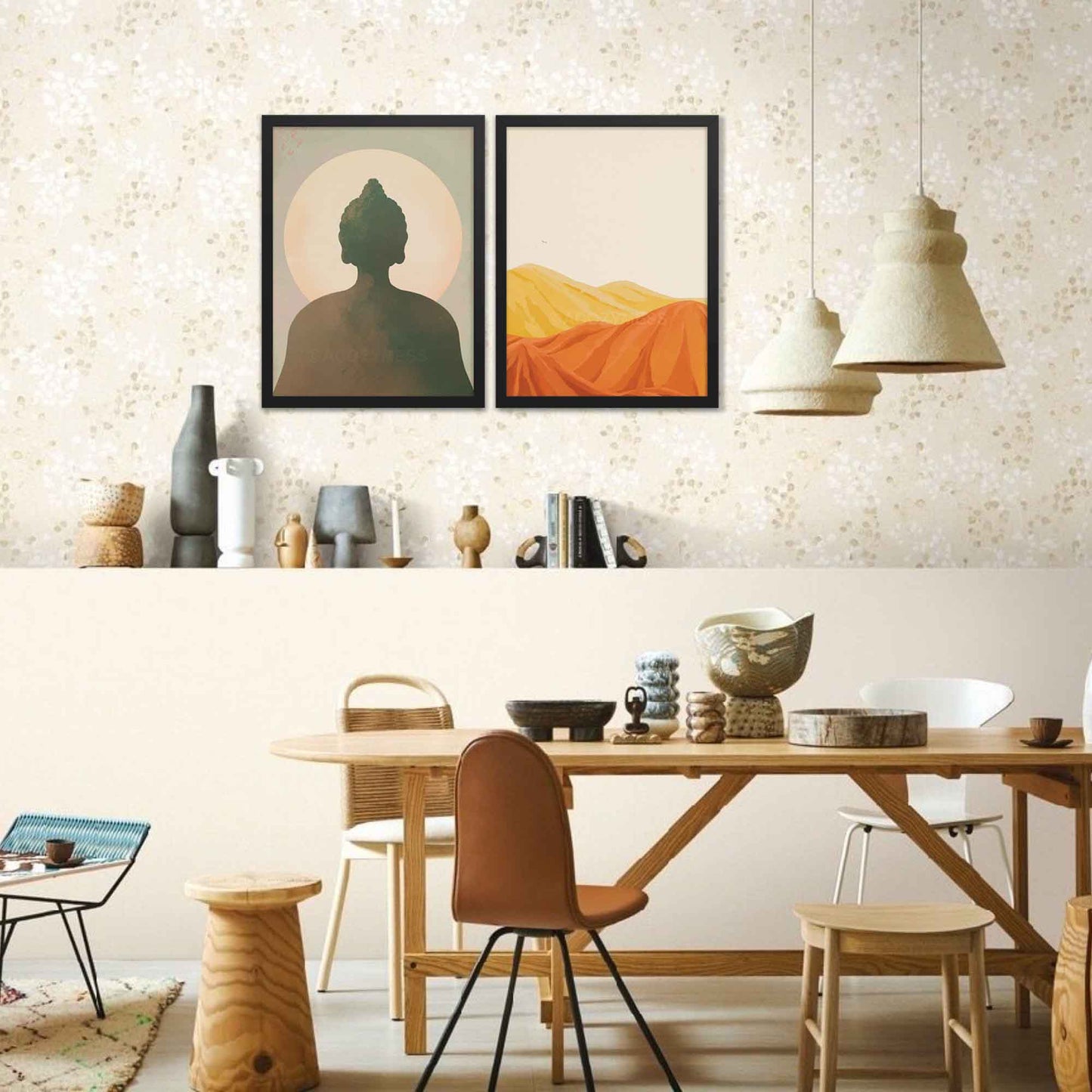 Desert mountain landscape artwork in warm yellow, orange, and brown tones with a beige background, in black frame on a gallery wall