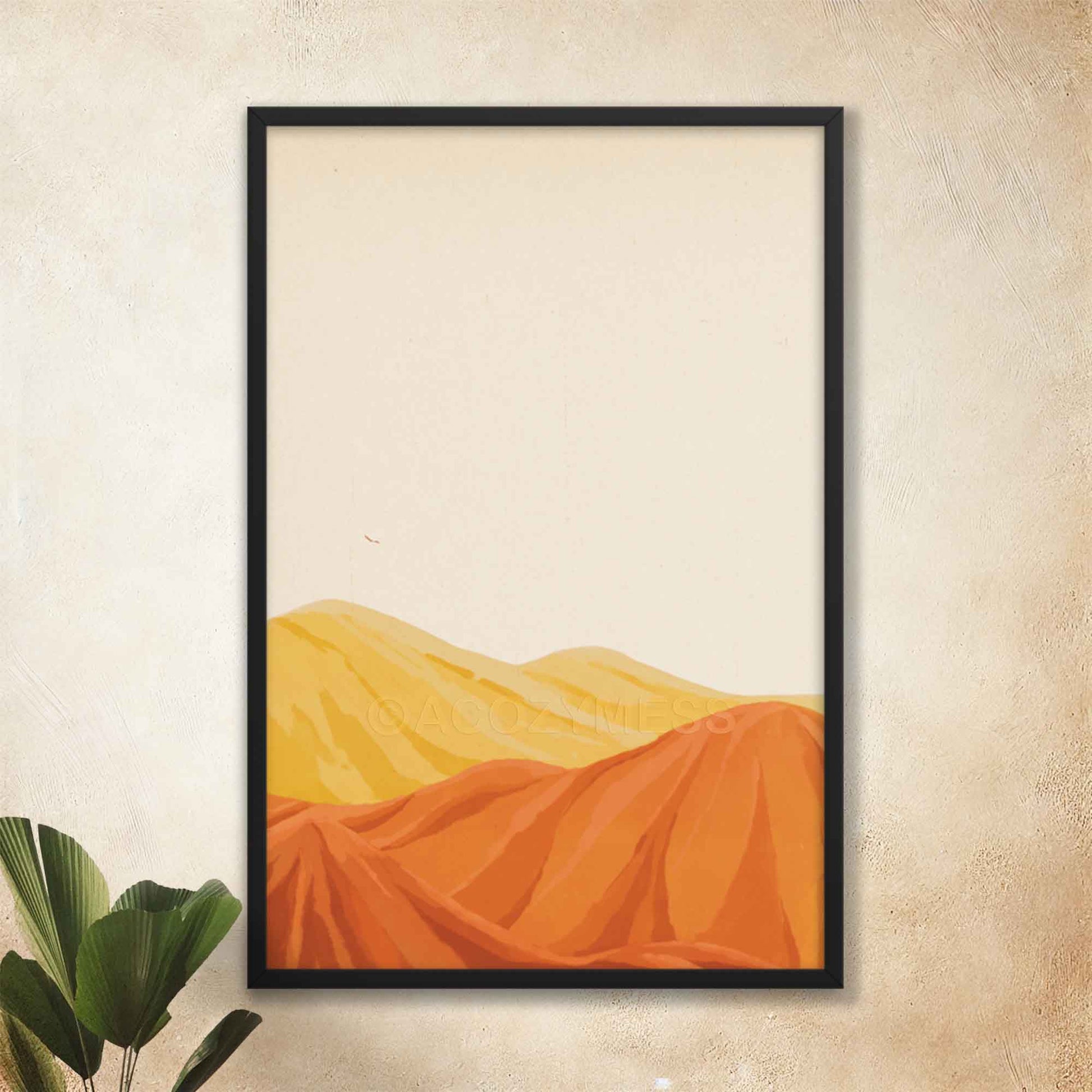 Desert mountain landscape artwork in warm yellow, orange, and brown tones with a beige background, in black frame