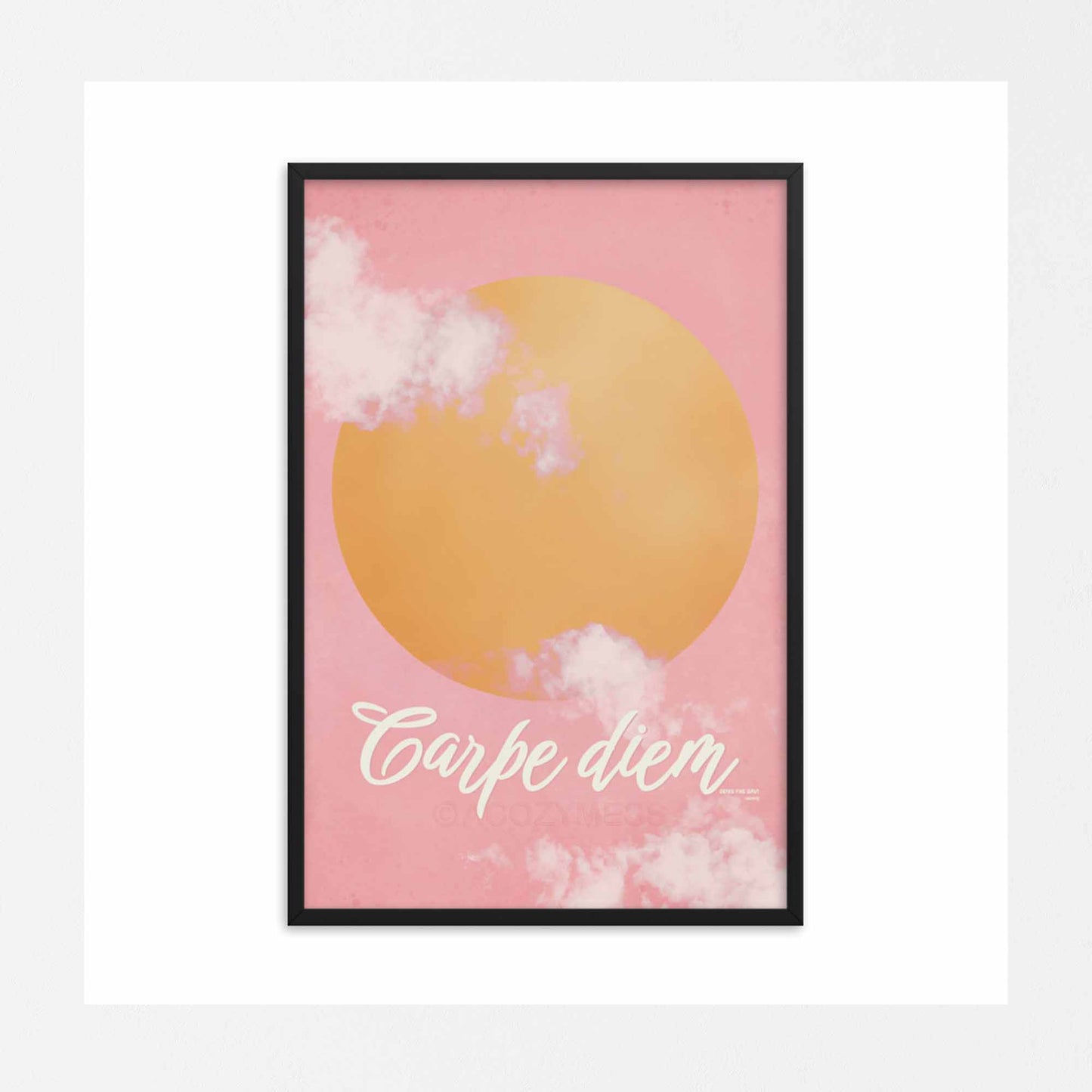 "Carpe Diem poster featuring a pink sky with soft clouds and a bright yellow sun, designed to inspire and uplift with the message 'Seize the Day.'" in black frame