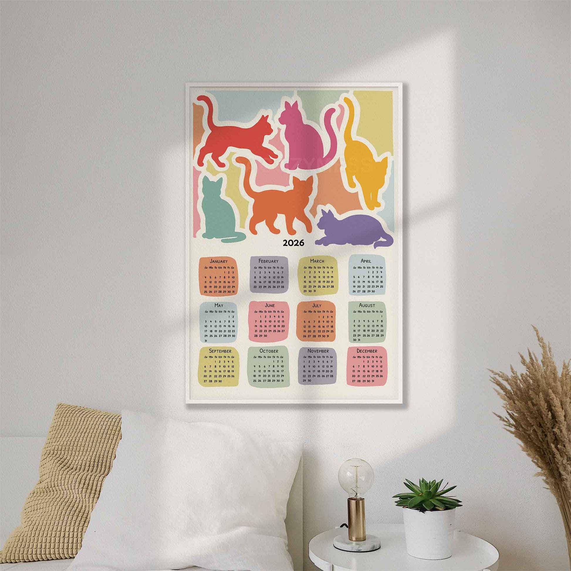 Colorful cat-themed calendar on a wall 