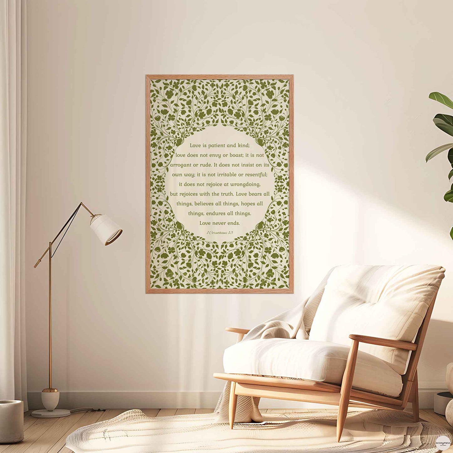 “Love is patient, love is kind” poster in a natural oakwood frame, featuring green floral artwork on a beige background—perfect for warm, rustic interiors or cottagecore decor