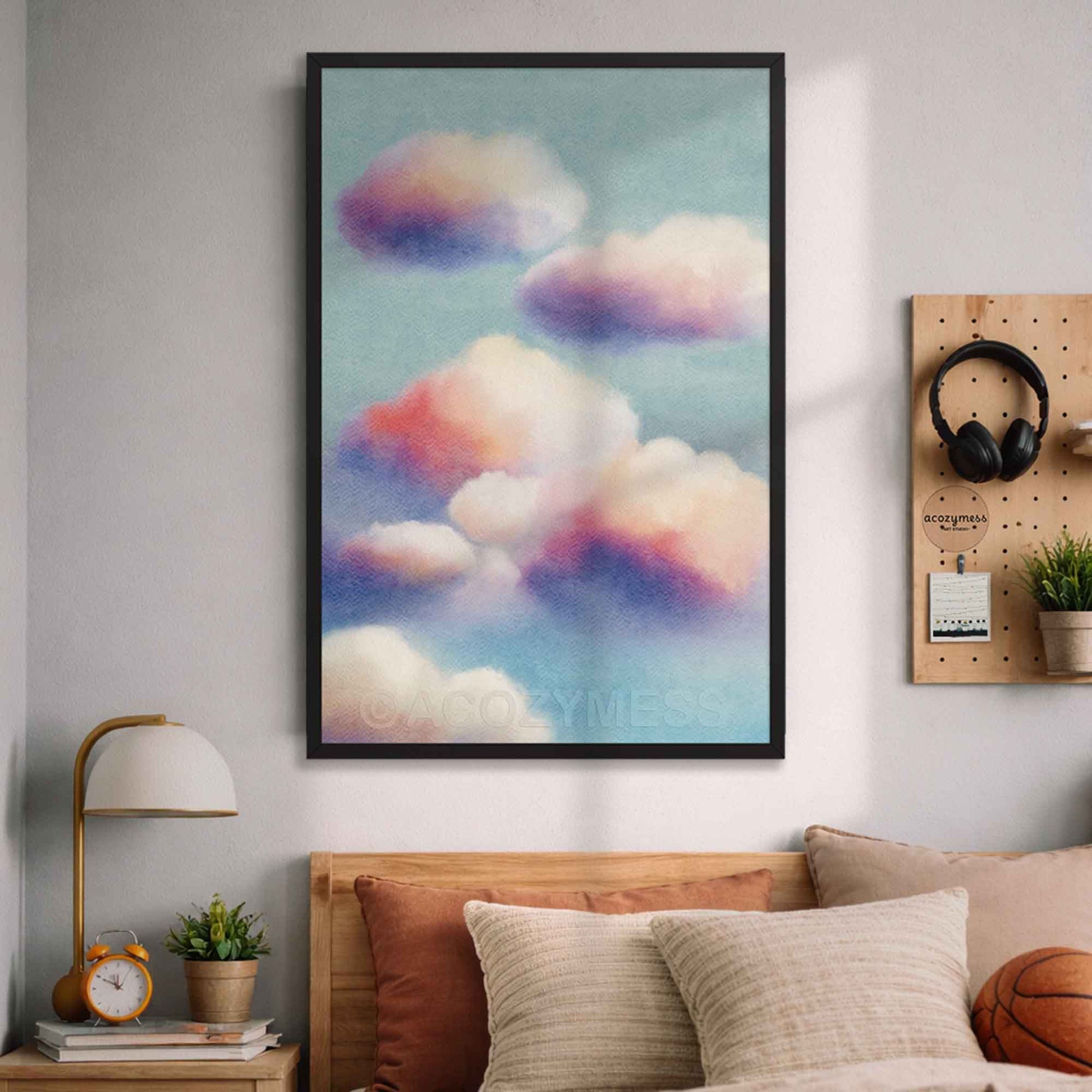 Modern cloudscape wall art in black frame—soft clouds on blue sky background for contemporary decor.