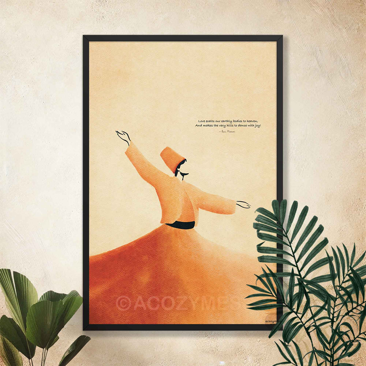 Black framed Rumi love quote print of a whirling dervish in terracotta robes on a cream wall with tropical plants
