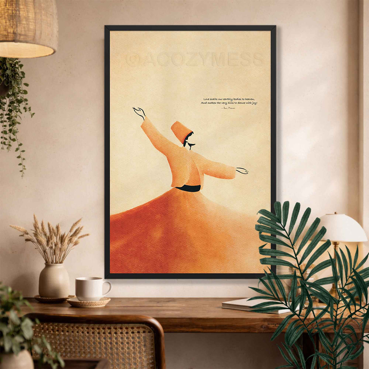 Black framed Rumi quote dervish wall art above a rustic desk with dried flowers and plants