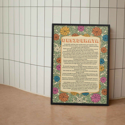 Desiderata poem Print with floral design in soothing colors of sage green, beige, orange and yellow displayed  in black frame