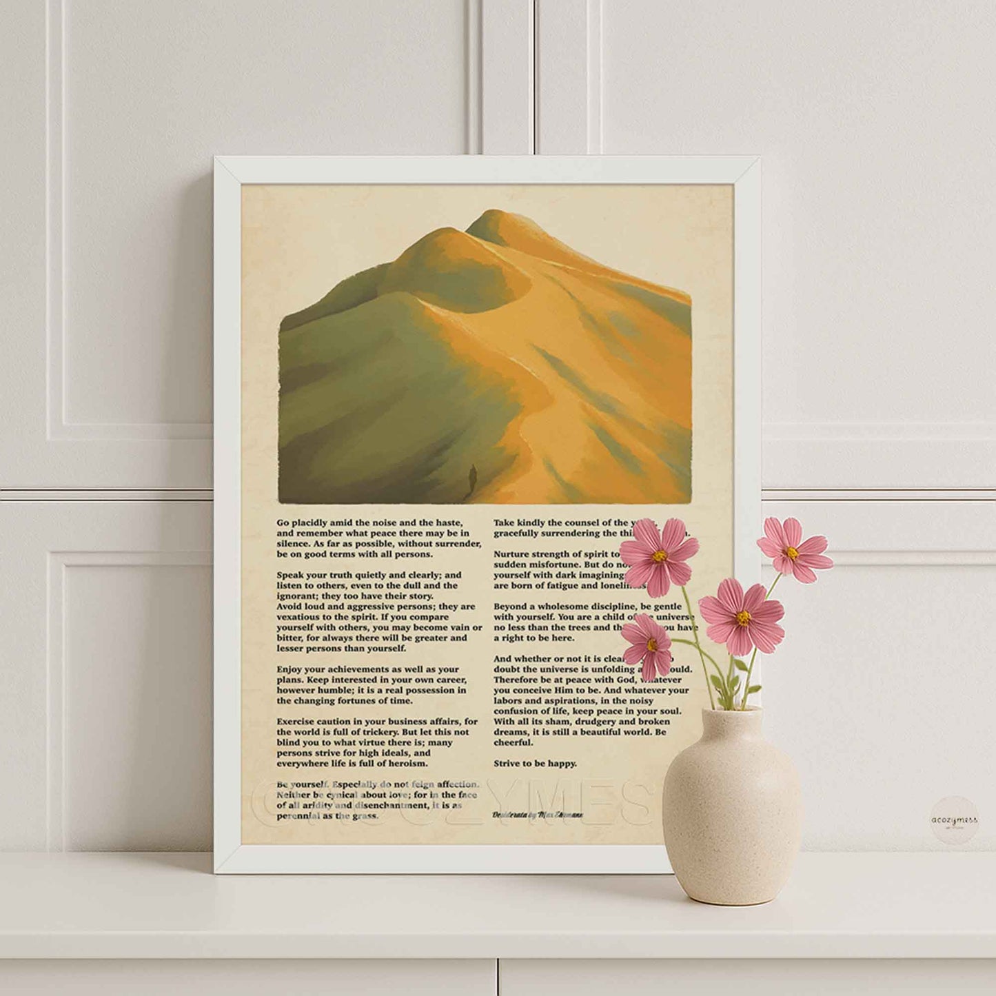 white Framed artwork with mountain illustration and Desiderata poem  