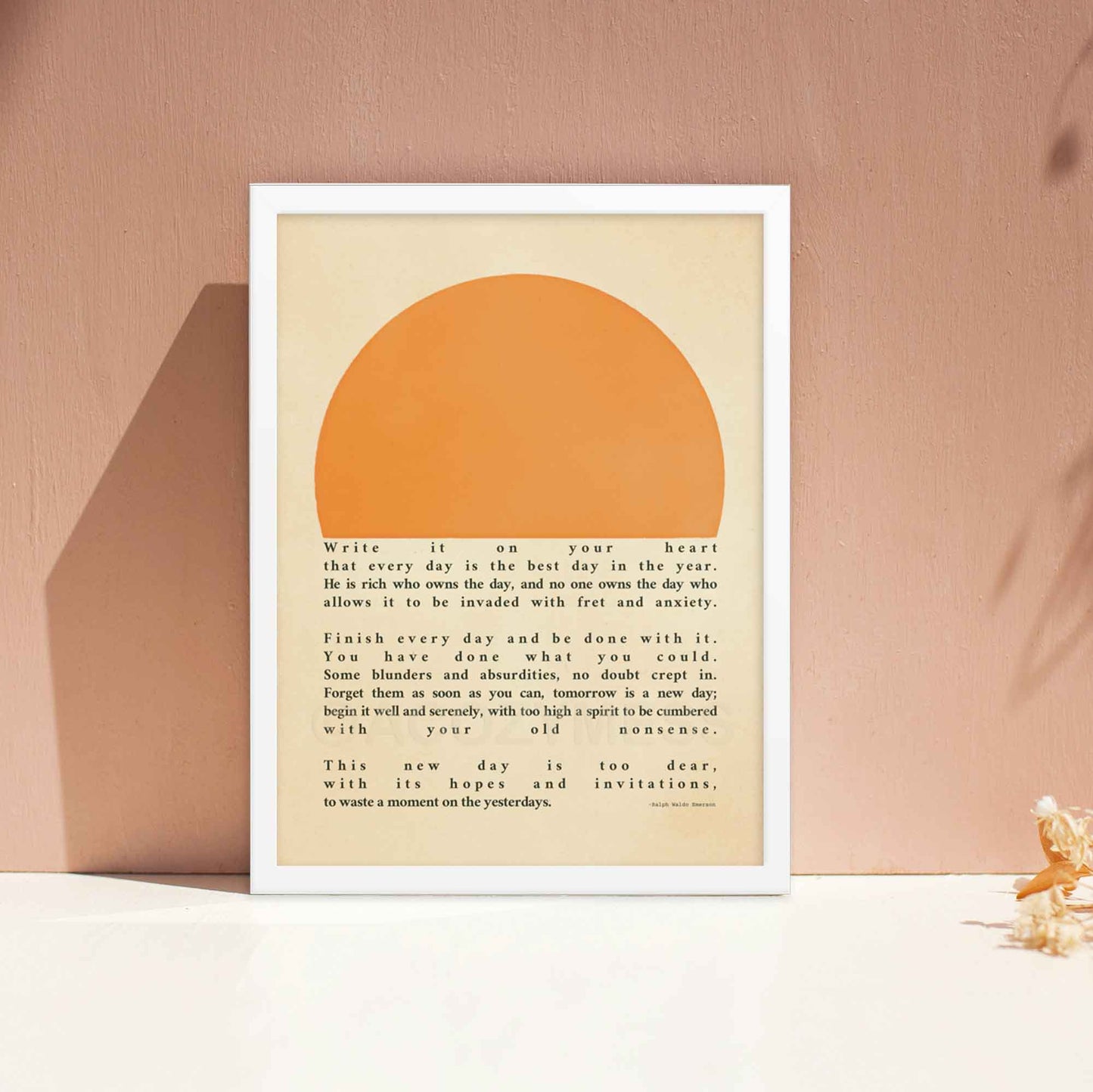 Poster featuring Ralph Waldo Emerson's inspirational quote, Write it on your heart..., with a warm sun illustration, displayed in a white frame.