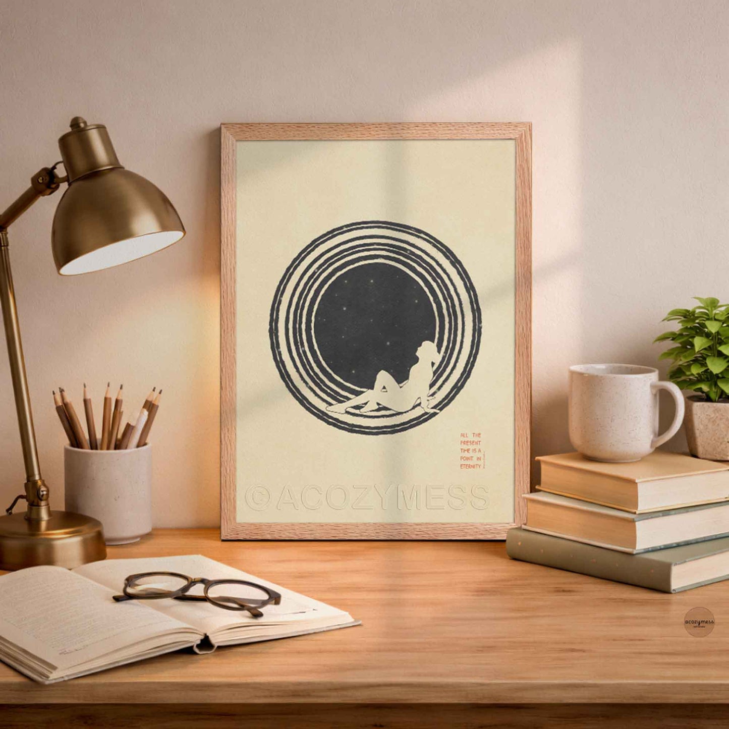 An oakwood framed  minimalist philosophy poster featuring a clean illustration of a lone figure stargazing beneath a vast, starry sky. The artwork is framed in a sleek border, displaying sharp typography with the Marcus Aurelius quote on present moment leaning on a desk .