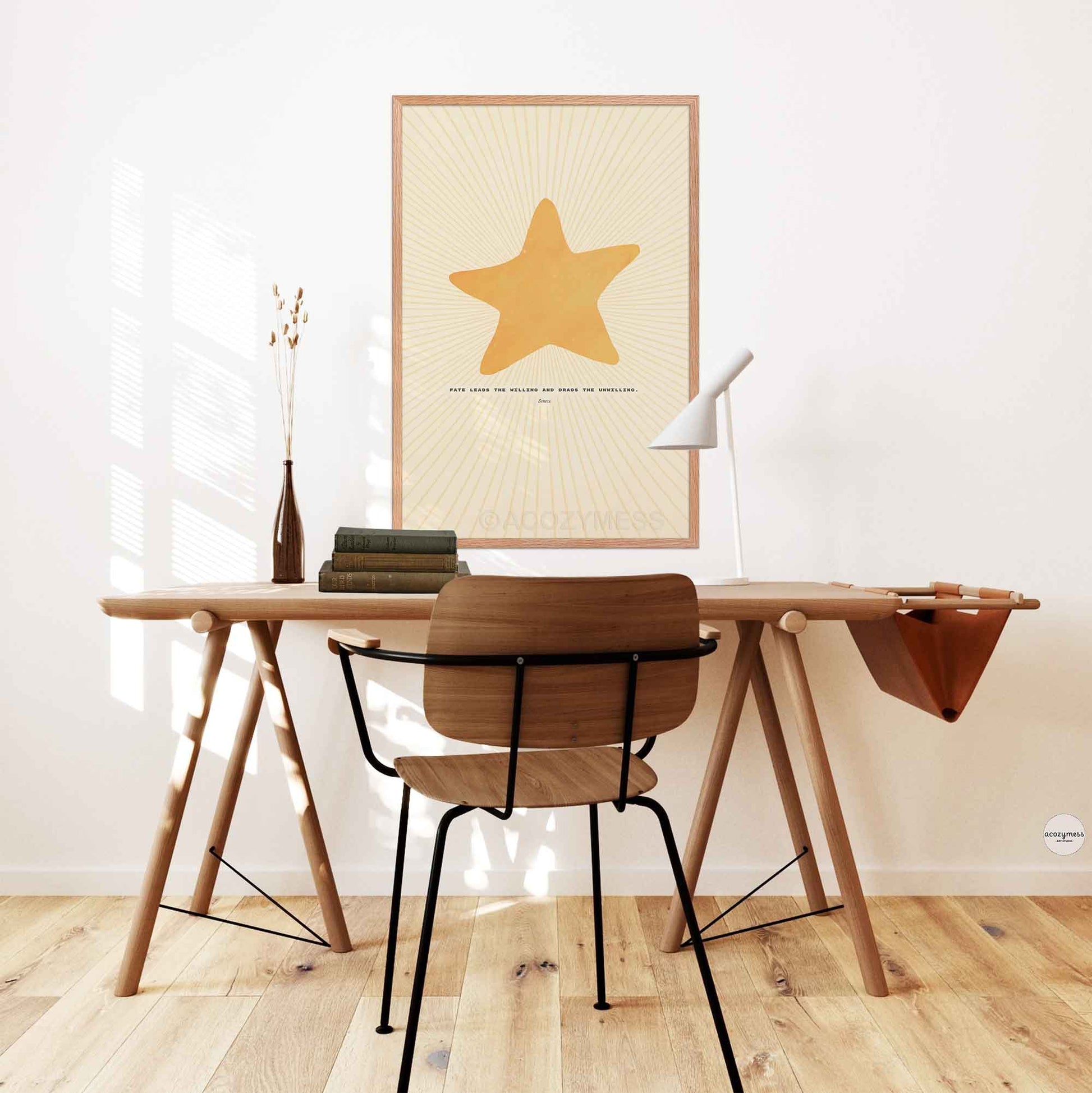 Seneca on fate quote poster with bright star illustration displayed in an oakwood frame, warm and natural finish in office or study room wall