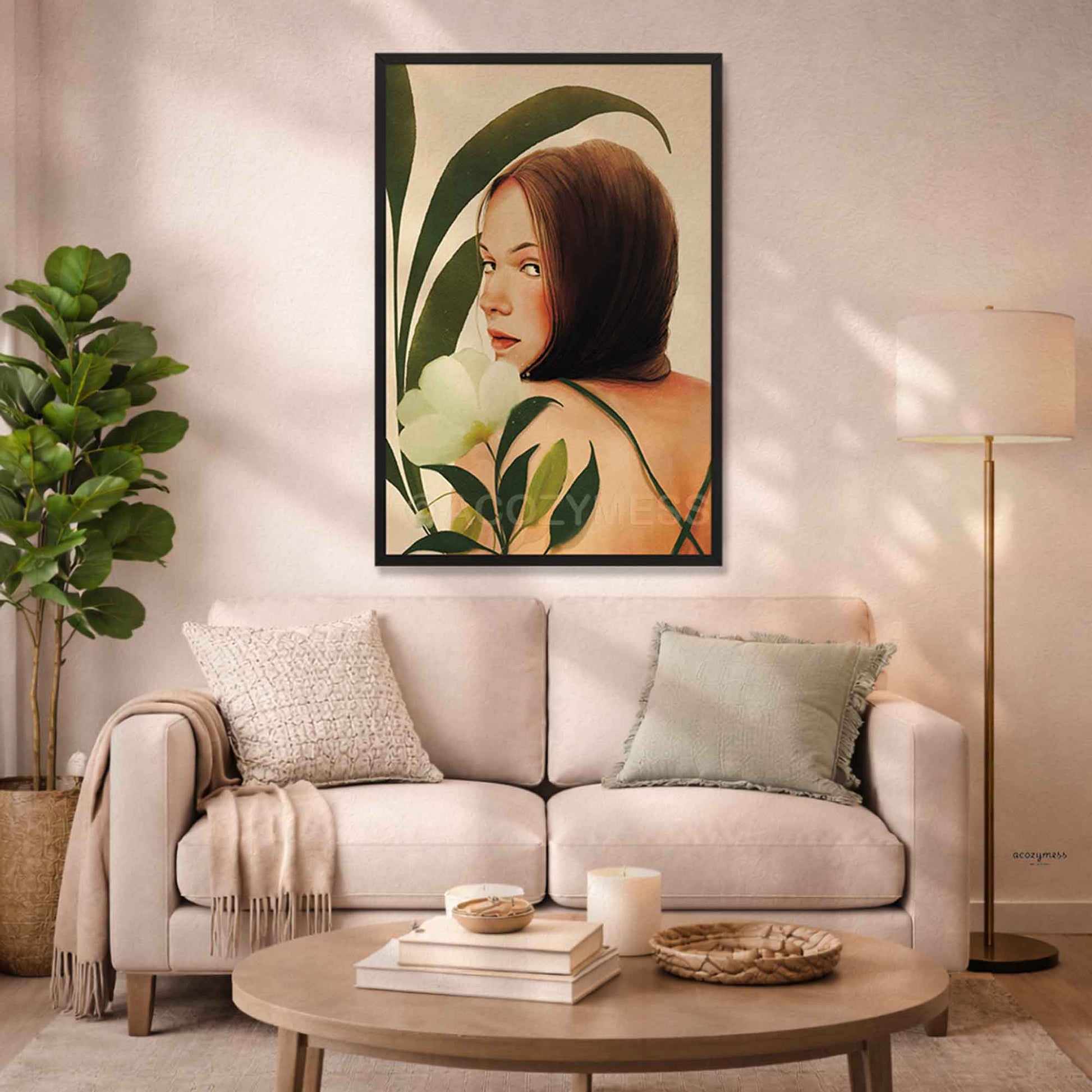 Earthy botanical female portrait print with sage foliage and burnt orange accents, displayed in a black frame in cozy living room.