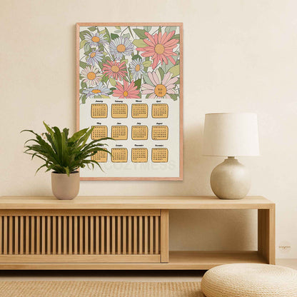 Framed floral calendar on a wall with floral art