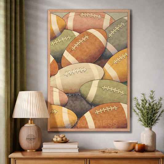 Framed artwork of colorful footballs on a wall above a wooden console table with decor items.