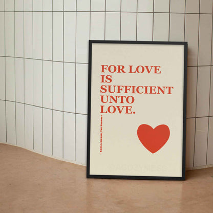 Kahlil Gibran poster with quote on love, red on beige with heart design, displayed in black frame.