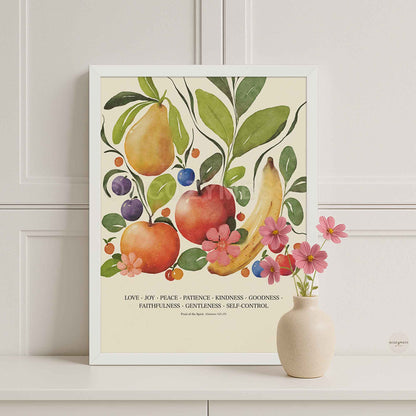 White framed Fruit of the Spirit poster with colorful fruit illustrations on a beige background, suitable for home or classroom decor.