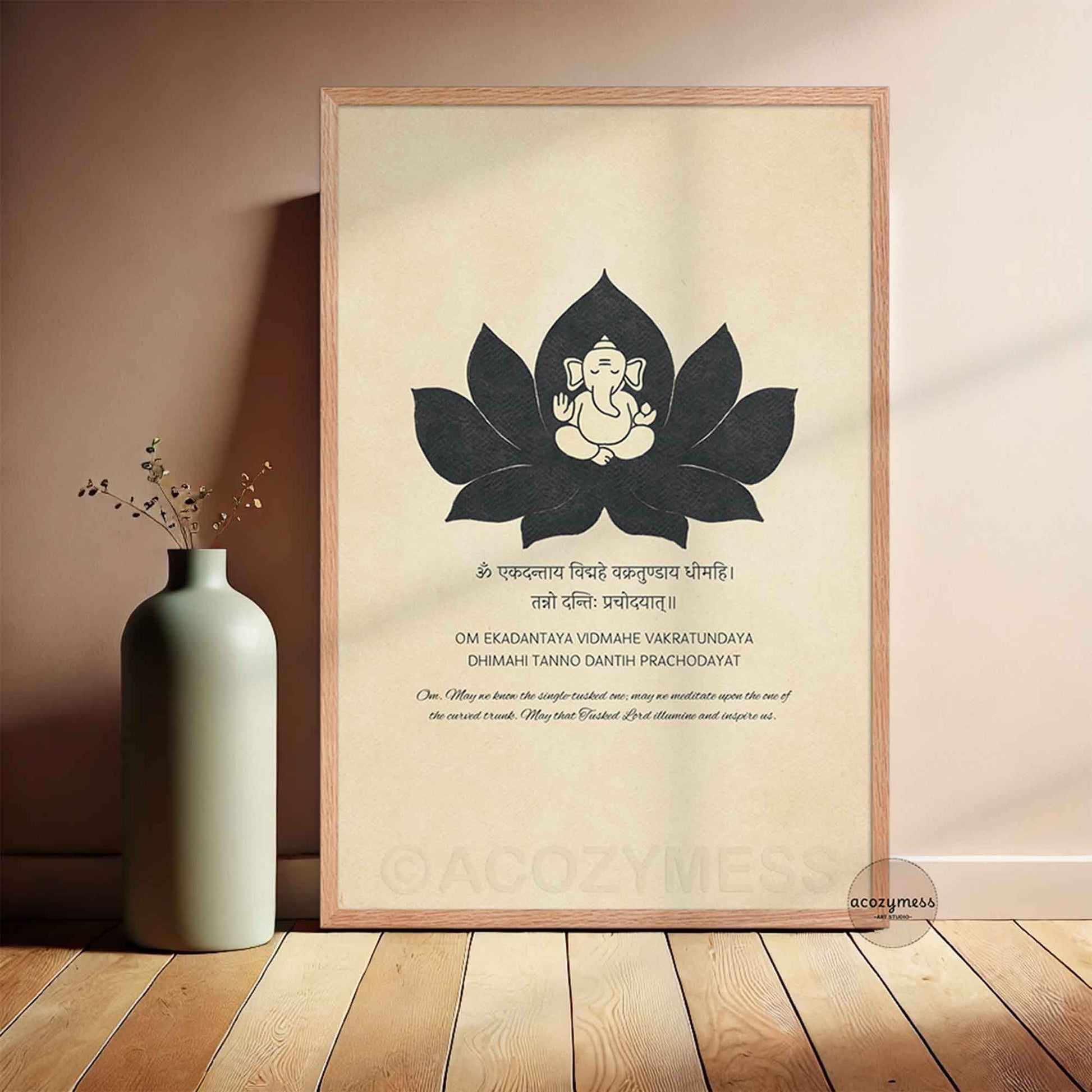 Ganesh Gayatri "Om Ekadantaya" mantra art print. Features a Ganesha and lotus illustration on beige in light wood frame.