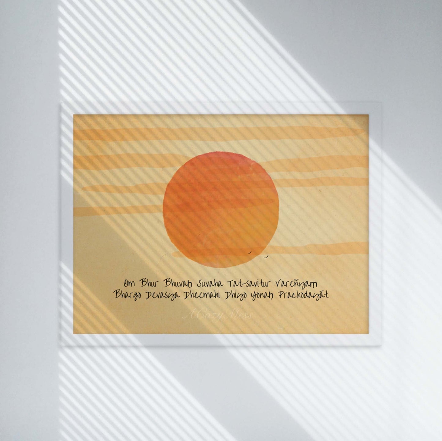 A wall art print featuring the Gayatri Mantra overlaid on a radiant sunburst, creating a spiritually uplifting and visually captivating artwork in white frame