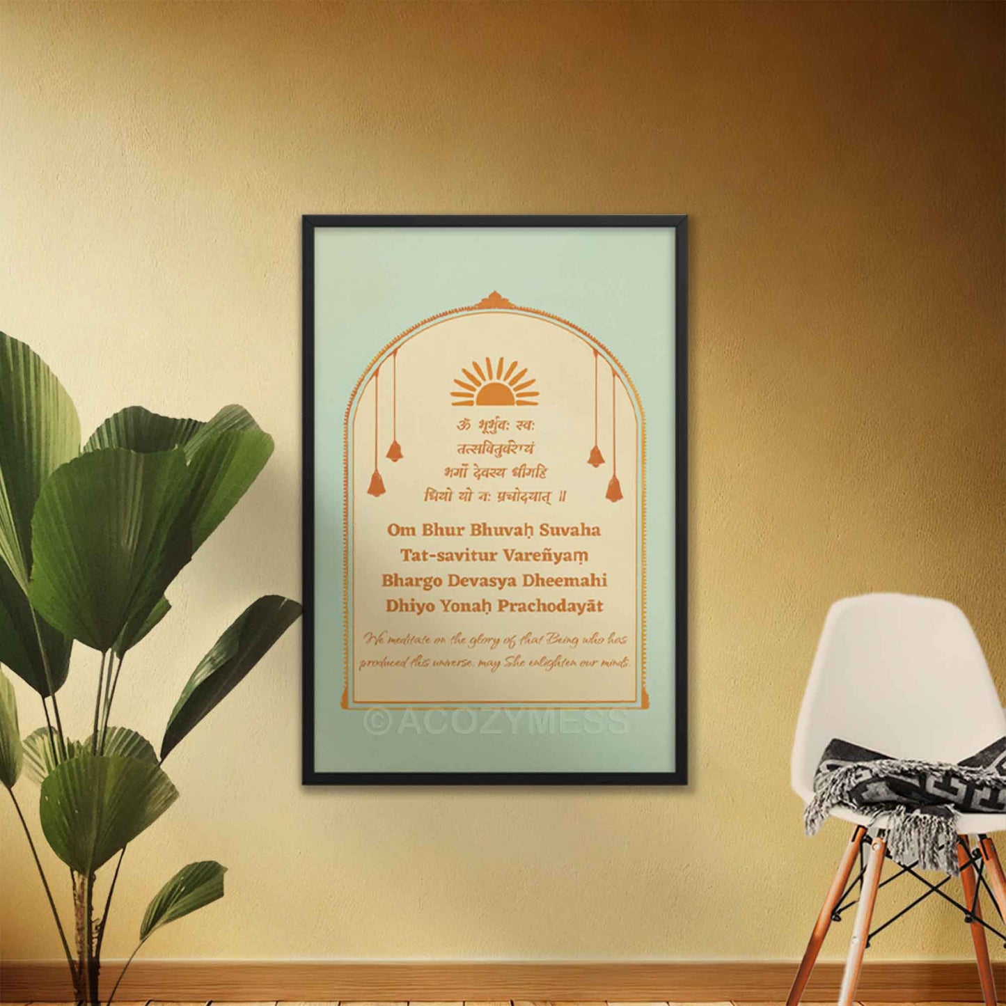 Gayatri Mantra Poster in blue, beige and orange colors with translation framed in black frame.