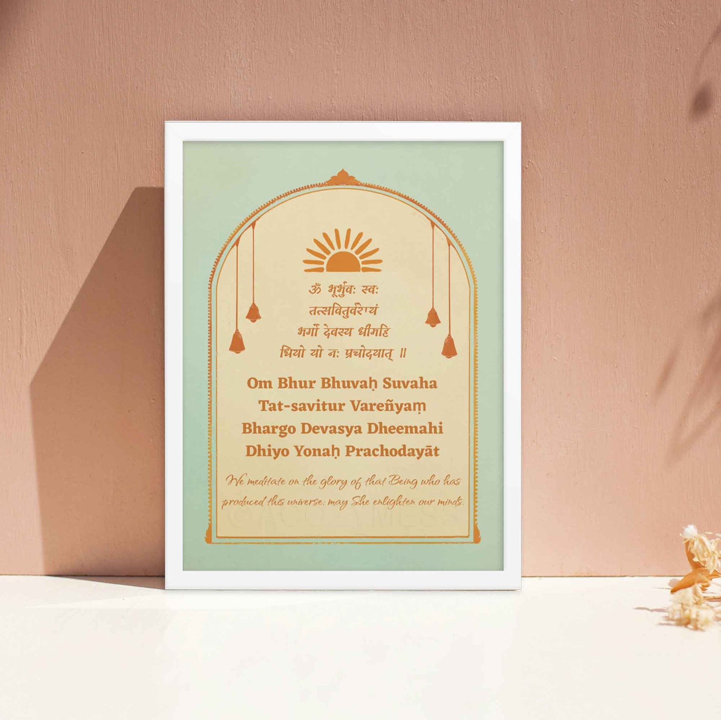 Gayatri Mantra Poster in soothing blue, beige and orange color palette  with translation framed in white frame.