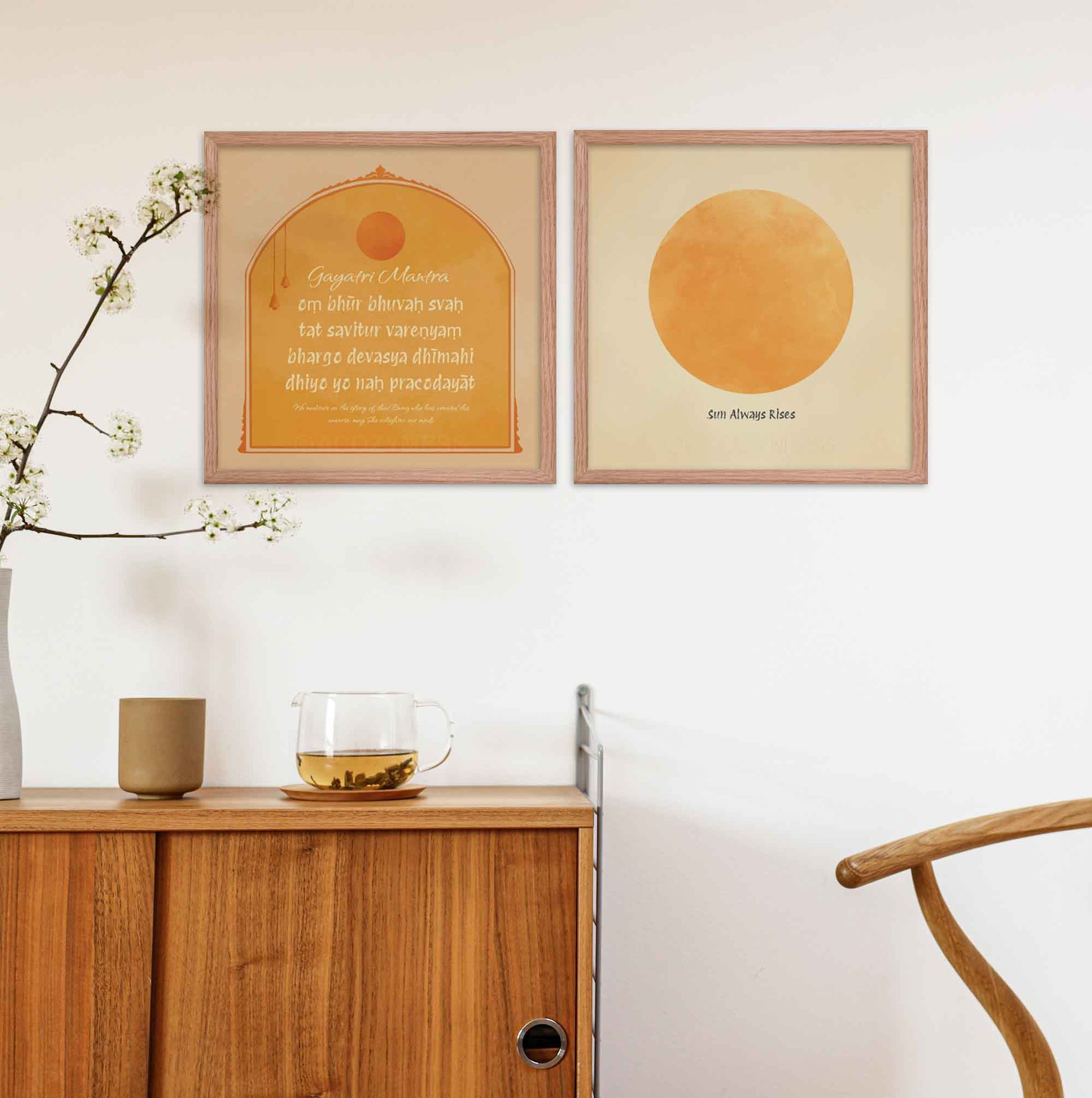 "Gayatri Mantra art print , and another art print of a huge sun art print ", in yellow, beige, and orange colors, framed in oakwood.