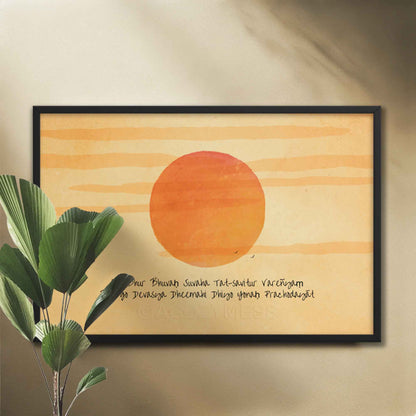 A wall art print featuring the Gayatri Mantra overlaid on a radiant sunburst, creating a spiritually uplifting and visually captivating artwork in black frame