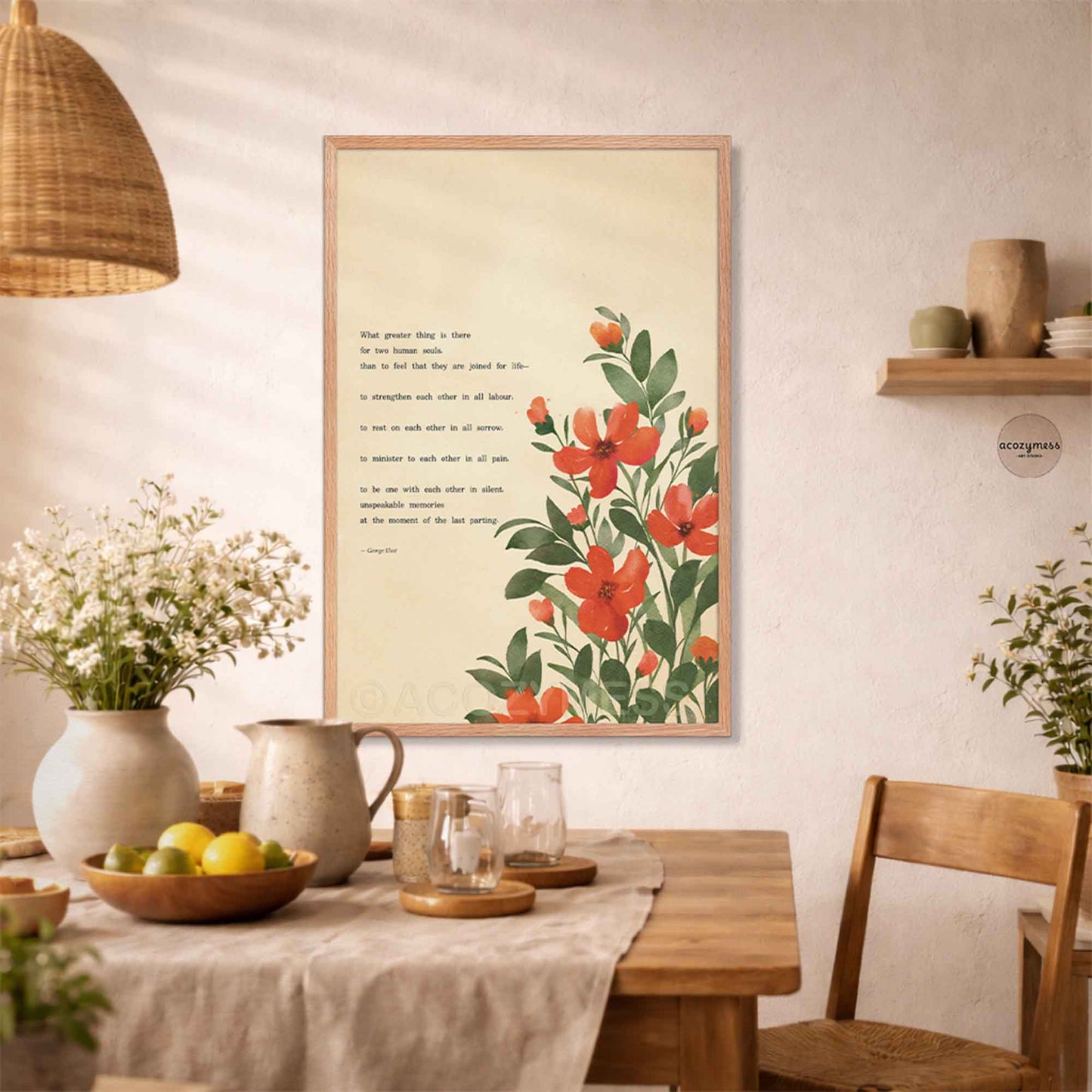 A framed art print featuring a botanical illustration of red flowers with green leaves on a cream background, alongside a quote by George Eliot. 