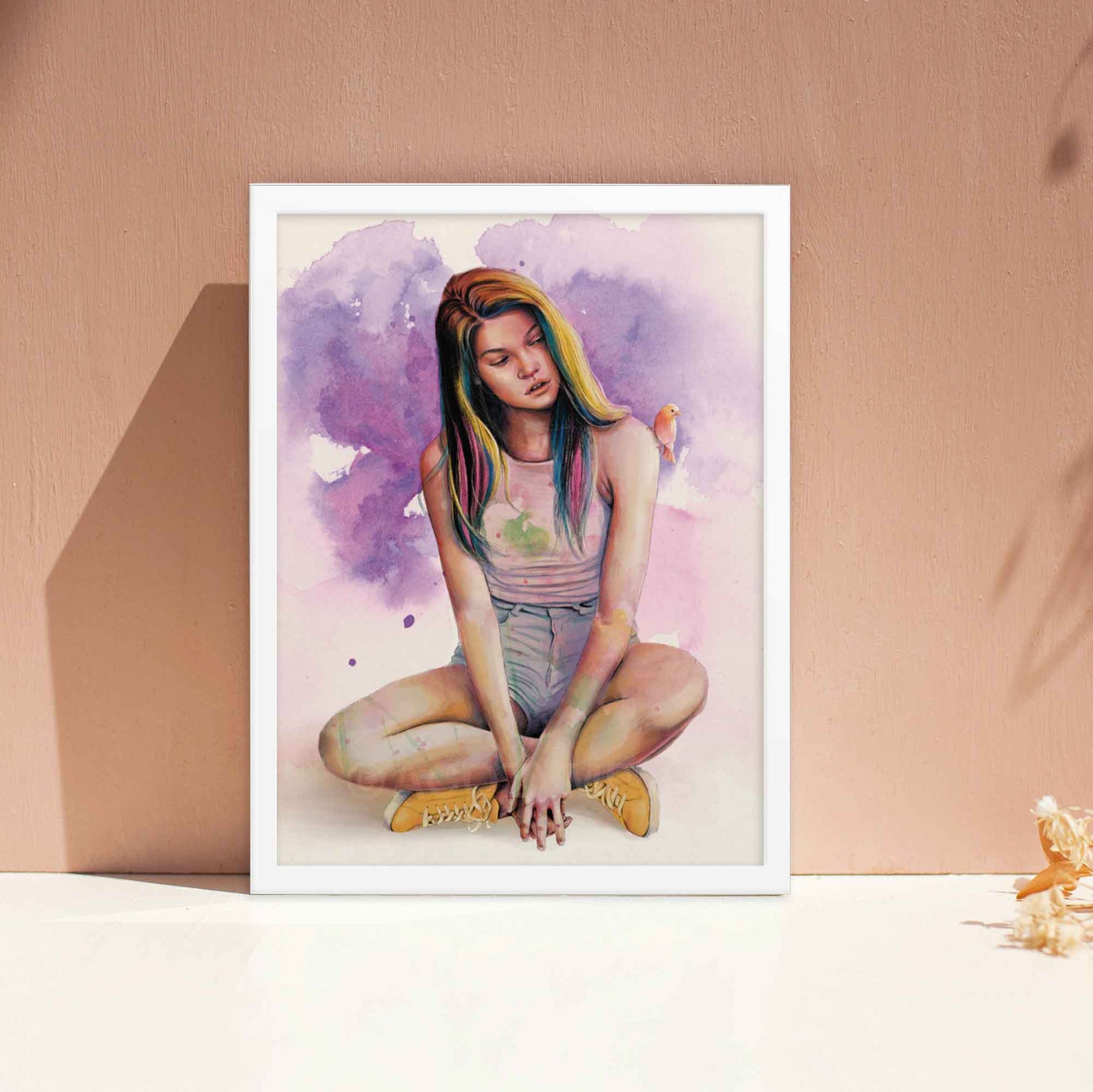 Artwork displayed in white frame, depicting a serene woman with a cute bird perched on her shoulder, done in purple, yellow, pink and blue.