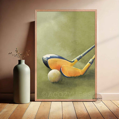 Framed artwork of golf clubs and a ball on a green background, leaning against a wall .