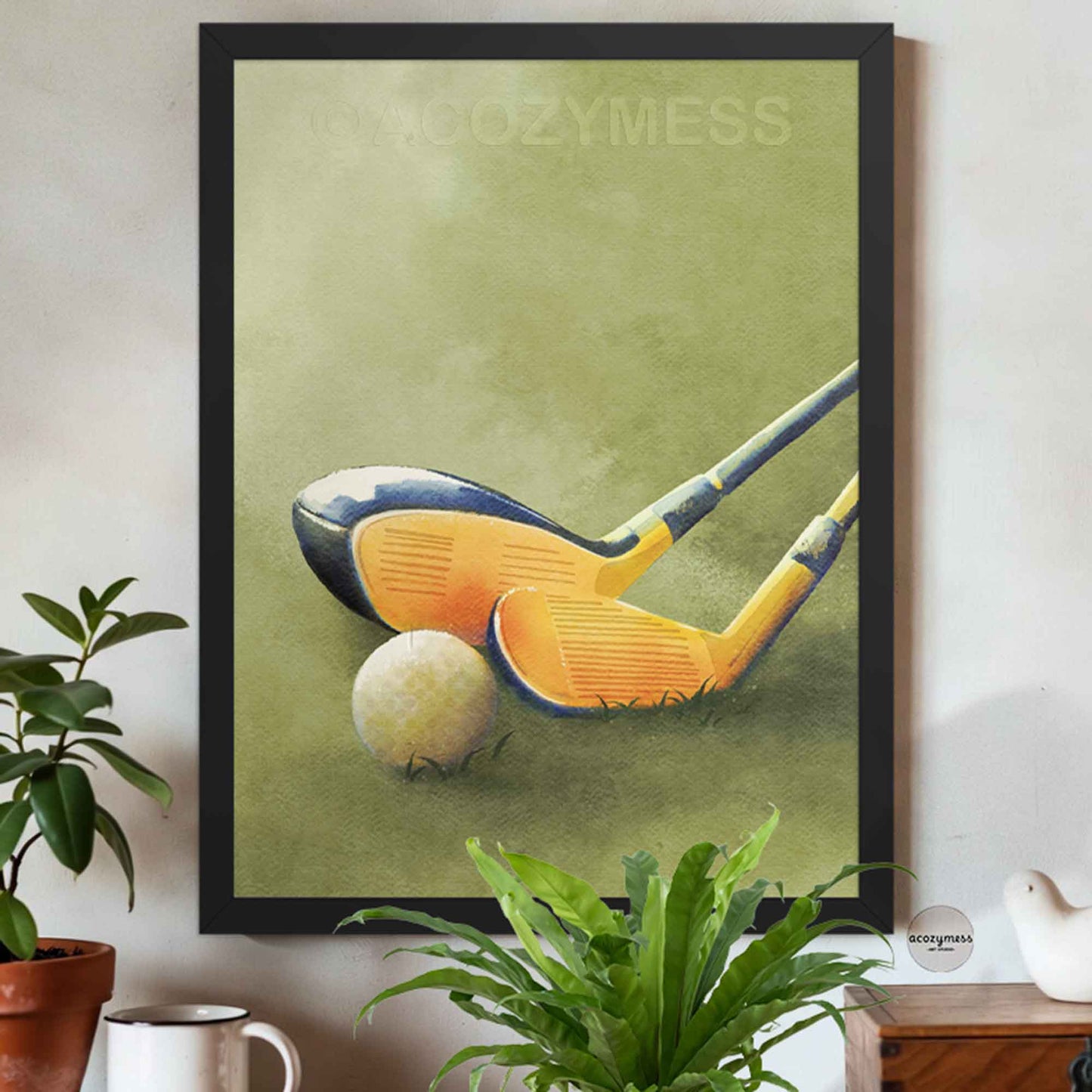 Golf clubs and ball print in a black frame, high-contrast modern wall art on a vivid green grass background.