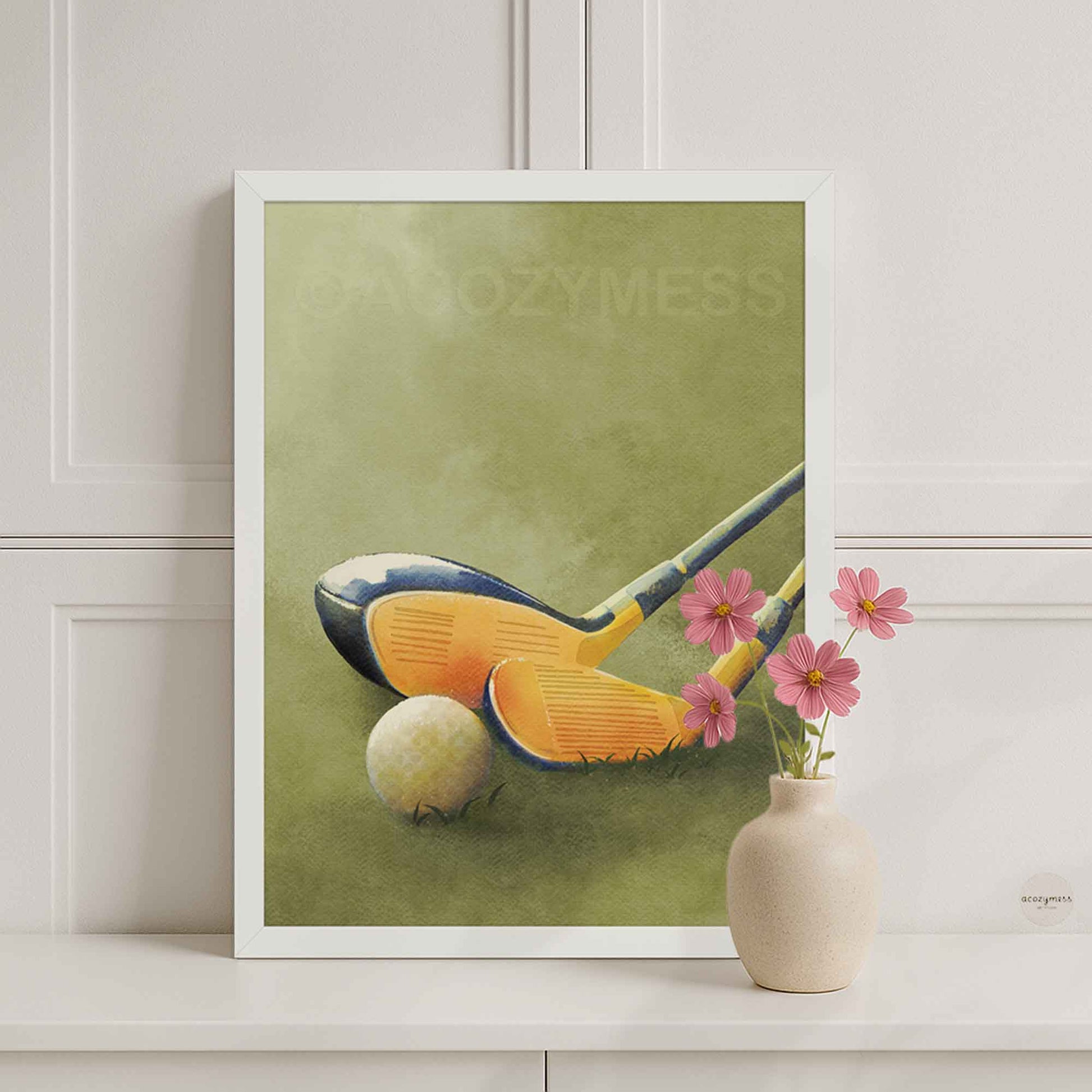 White-framed golf wall art featuring golf clubs and a ball on a green grass background for clean, modern decor.