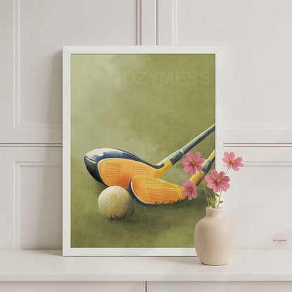 White-framed golf wall art featuring golf clubs and a ball on a green grass background for clean, modern decor.